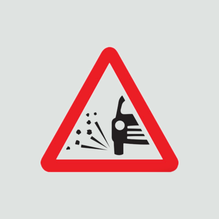 Warning of loose gravel